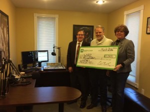 Teresa Ray, right, HCCF Board Member, and William Rhodehamel, HCCF Executive Director present the Hendricks County FM Radio Station WYRZ Executive Director Shane Ray, with $1,000 grant in celebration of the Hendricks County Community Foundation's 20th anniversary
